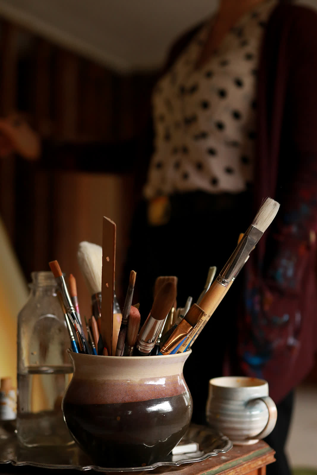 Paint brushes in a ceramic pot at The Haven
