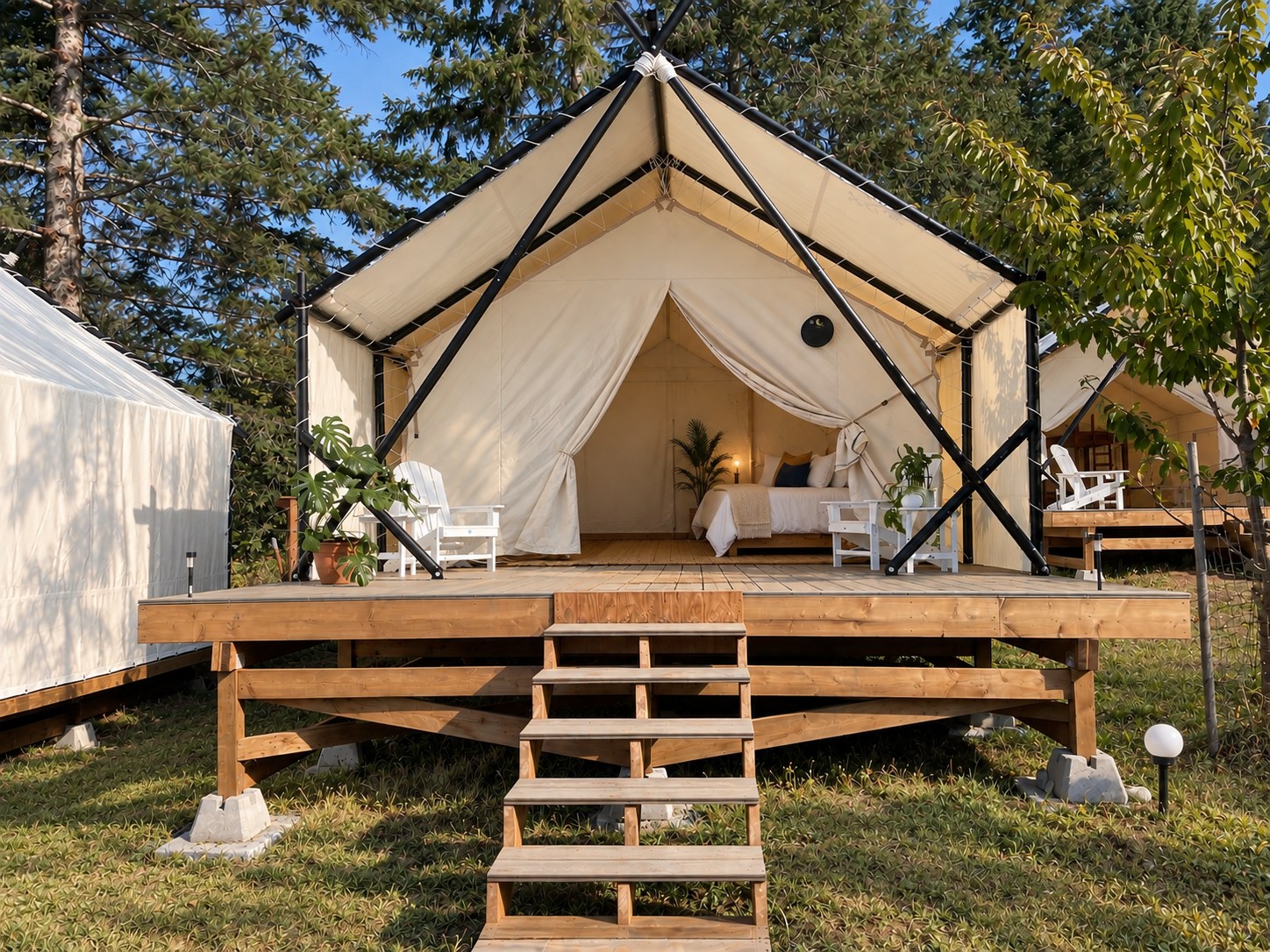 The entrance and deck of a canvas tent by day
